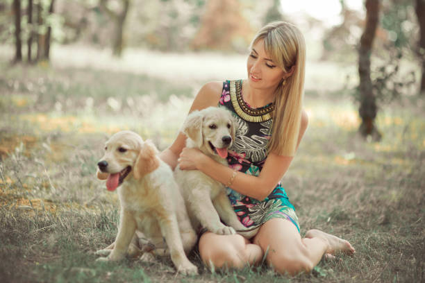The Johnson family surrounded by their Golden Retrievers on their farm